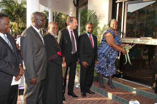 BTC-Store-Opening---Maurine-Prescod-cuts-the-ribbon-as-Minister-Vanderpool-Wallace_-Geoff-Houston_-Reverend-Patrick-Adderley_-Tellis-Symonette-_-Ant.jpg