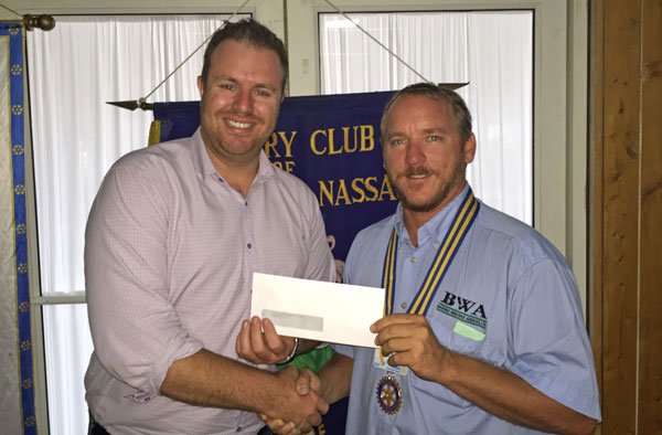 Dir.-of-Marketing-Ash-Henderson-presents-the-donation-from-the-Myers-Group-of-Restaurants-to-Rotary-East-Nassau-President-Jason-Robertson_1.jpg