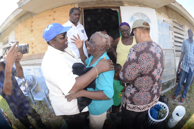 Minister_Griffin_Greeting_a_Crooked_Islander_at_the_Shelter.jpg