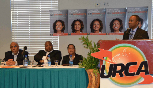 URCA_Board_members_from_left_to_right_are_J_Paul_Morgan_Deputy_Chairperson__Randol_Dorsett_URCA_Chairperson__Kathleen_Riviere_smith_URCA_CEO__C_Vincent_Wallace_Whitfield_URCA_General_Counsel___Board_Sectretary__BIS_.jpg