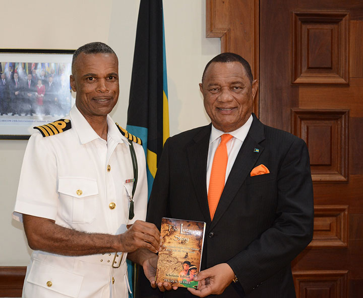 Captain-Tellis-Bethel-Presents-Book-to-the-Prime-Minister.jpg