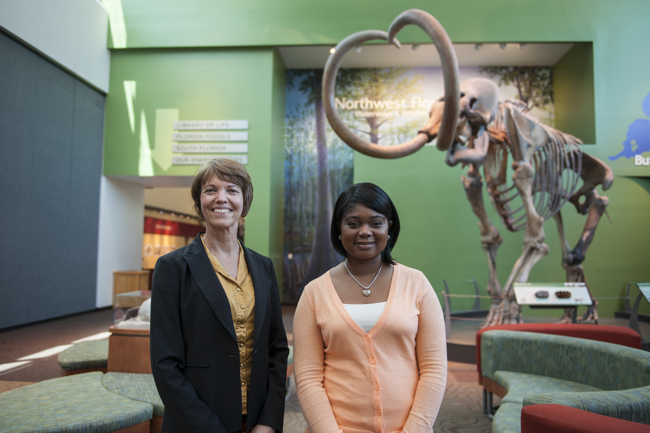 Photo_1_AMMC_Miller_with_Darcie_Macmahon__Director_of_Exhibits___Public_Programs_and_I_in_front_of__the_Columbian_Mammoth_in_the_Main_Gallery_of_the_Florida_Museum_of_Natural_History.-1.jpg