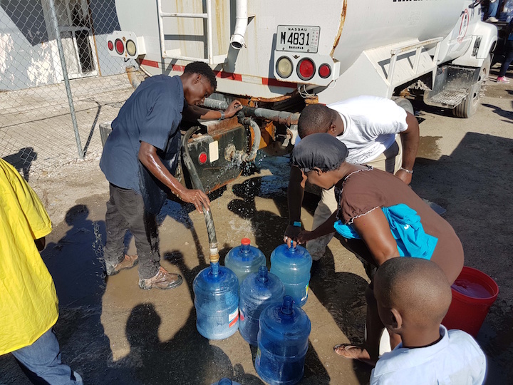 Residents_receive_potable_water.jpg