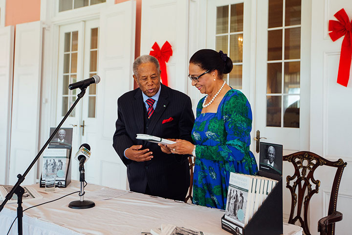 Sir-Orville-Turnquest-presents-a-copy-of-his-book-to-Her-Excellency-Dame-Marguerite-Pindling_-GG-rz.jpg