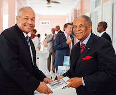 Sir-Orville-presents-a-signed-copy-of-his-book-to-Dr.-Rodney-Smith_-president-of-the-University-of-The-Bahamas.-rz.jpeg