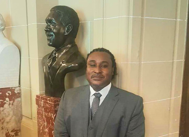 Bahamian artist Andret John is pictured with the bust of the late Sir Lynden Pindling, the first Prime Minister of The Bahamas, after it was unveiled in the Hall of Heroes of the Organization of American States (OAS) on Thursday, April 20, 2017. John, who was born in Eleuthera in 1973, the year that The Bahamas attained independence from Great Britain under the leadership of Sir Lynden, said he was “beyond excited when I got the news of being commissioned to sculpt the bust of Sir Lynden.” ANDRET_JOHN_AND_BUST.jpg