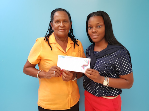 BTC_makes_a_special_donation_to_GGYA._National_Executive_Director_Denise_Mortimer_and_Ajna_Darling_BTC_Public_Relations.jpg