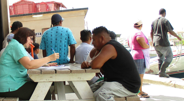 Claudia_interviewing_at_Northern_Fishermen_s_Co-op_Belize.jpg