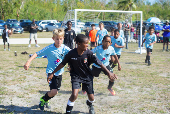 Photo_1-_Players_go_hard_at_Domino_s_Manta_Rays_Inaugural_soccer_tournament_.jpg