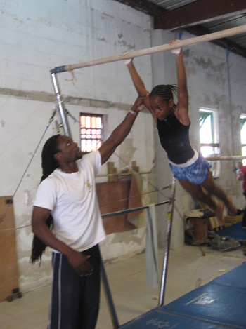 NasticsCoach_Trevor_with_uneven_bar_gymnast_1_.JPG