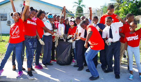 01312019_StCecilia_sBeAHero15_-_group_of_students_with_trash_bag.jpg