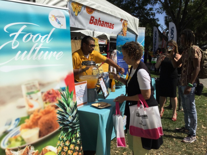 Bahamas_Tourism_Sr._Manager__Adrian_Kemp_serves_drink_at_Bahamas_Booth_at_Taste_of_The_Islands_Experience.jpg