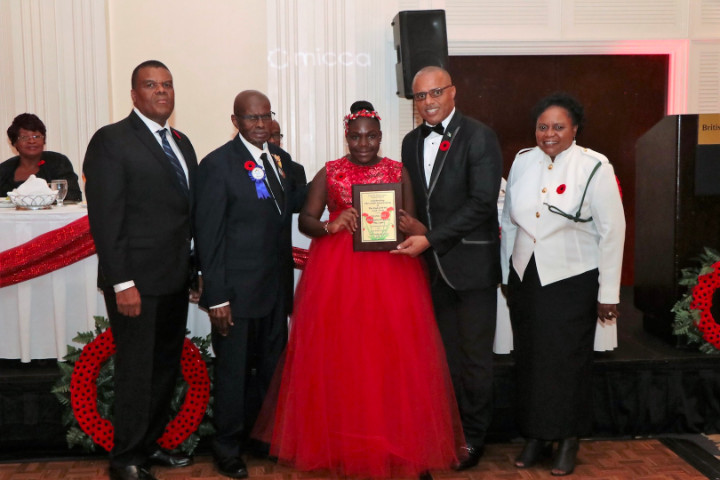 Centennial_Miliary_Ball_-_Clintaysia_Ferguson_with_Award_from_Minister_Dames_1_.jpg