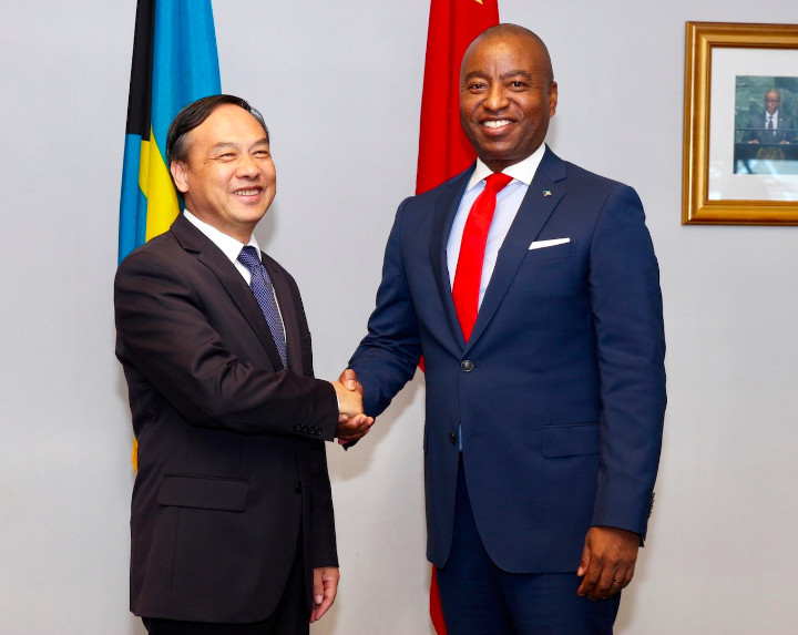 Chinese_Ambassador_and_Minister_of_Foreign_Affairs_in_Handshake_at_Signing_Ceremony.jpg