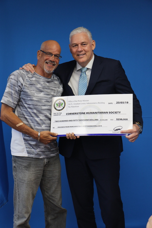 Cornerstone_s_Mr._Desmond_Phillip_receives_donation_of__250.000_from_Prime_Minister_Hon._Allen_Chastanet.JPG