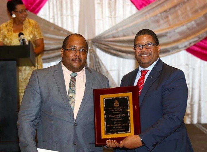 DPM_Turnquest__right__and_Dr._Lester_Gittens_-_Public_Service_Officer_of_the_Year_2018-2019_1__1_.jpg