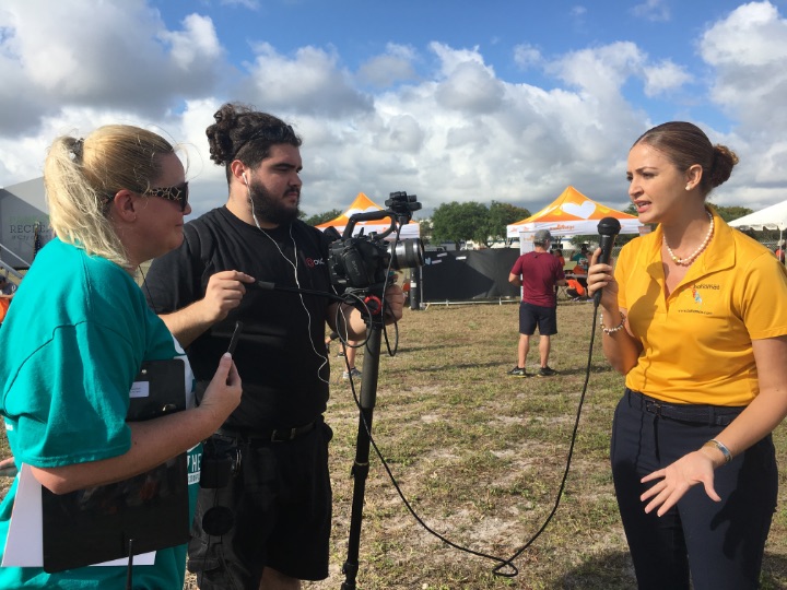 District_Manager__Bahamas_Tourist_Office__Florida__being_interviewed_at_5K_On_The_Runway_Race.jpg