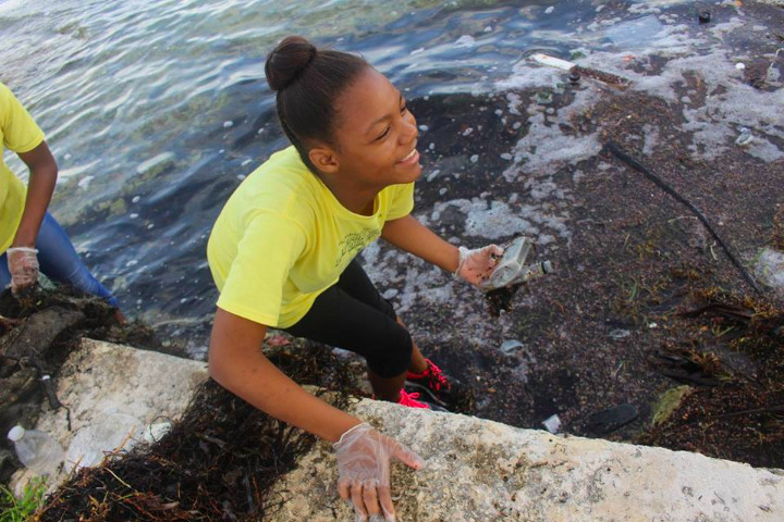 Freeport_Gospel_Chapel_School___________student_retrieving_bottles_from_the_wetland_area.jpg