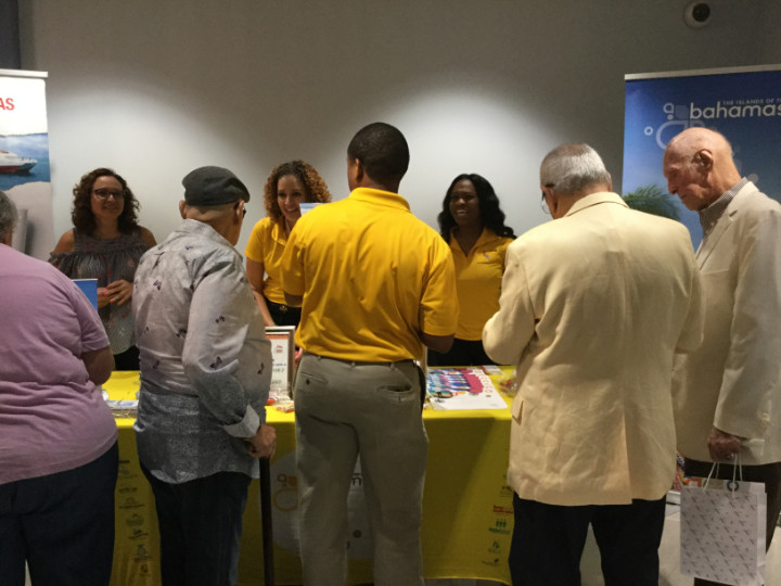 Registering_for_drawing_at_Bahamas_booth_at_art_gallery_opening.jpg