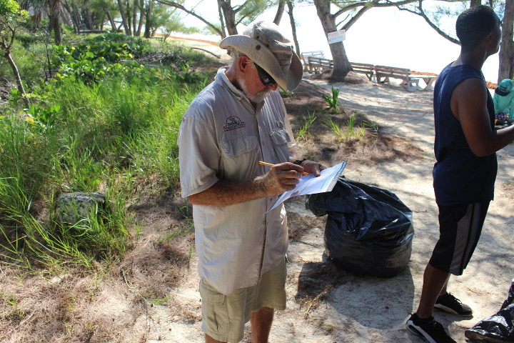 Renowned_Underwater_Naturalist_Ben_____Rose_fills_out_his_data_card_on_International_Coastal_Cleanup_Day.jpg