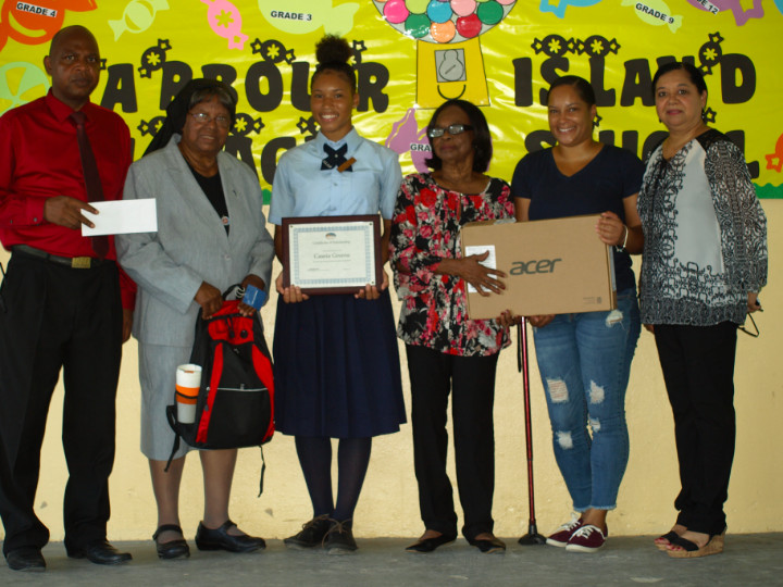 Scholarship_Recepient_with_her_mom___Principal_and_Romalia_s_Townhouse_Team.jpg