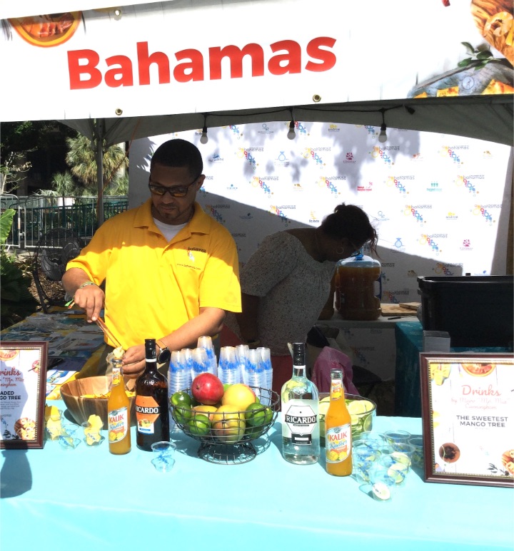 Sr._Marketing_Manager__Baamas_Tourist_Office__Florida__Adrian_Kemp__prepares_for_tasting_at__Bahamas_Booth_.jpg
