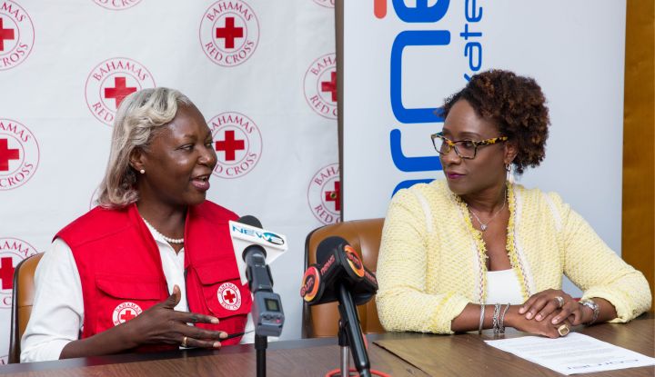 Corner_Bank_presents_cheque_to_Red_Cross_Bahamas_-_Terez_Carey_and_Christine_Russell.jpg