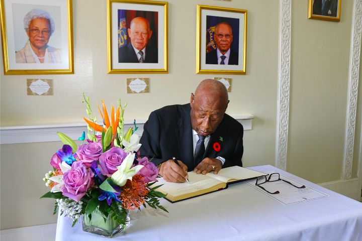 Governor_General_Signs_Book_of_Condolence_at_Lie-in-State_of_Former_Senator_Dr._Calsey_Johnson.jpg