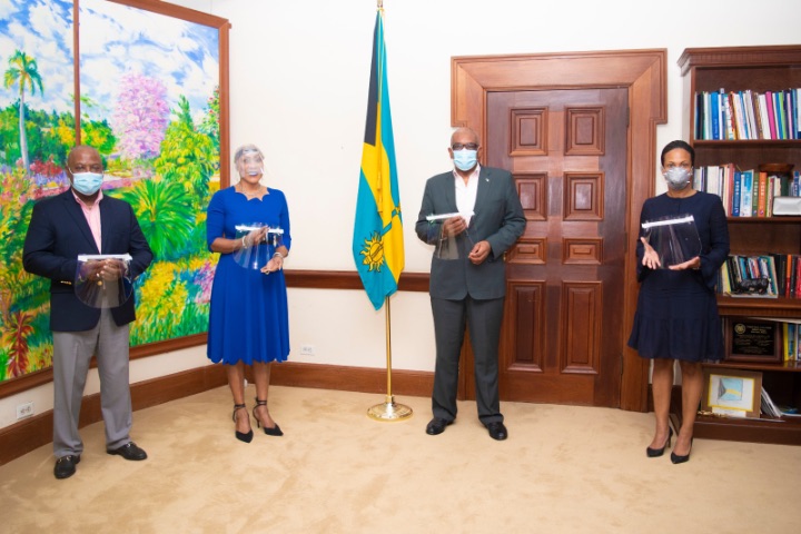 PM_Minnis__centre__accepts_donation_of_locally_produced_face_shields_for_healthcare_workers.jpg