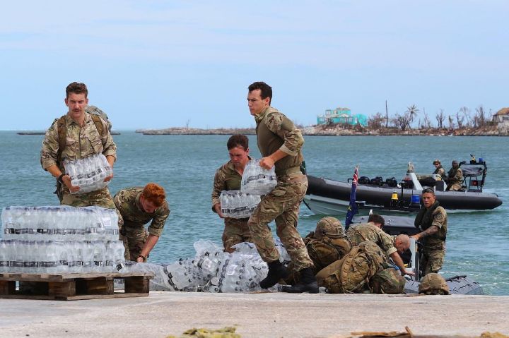 Ph_14_-_Officers_from_the_British_naval_Ship_off_load_water_for_distribution_on_Wednesday_following_the_storm_1.jpg