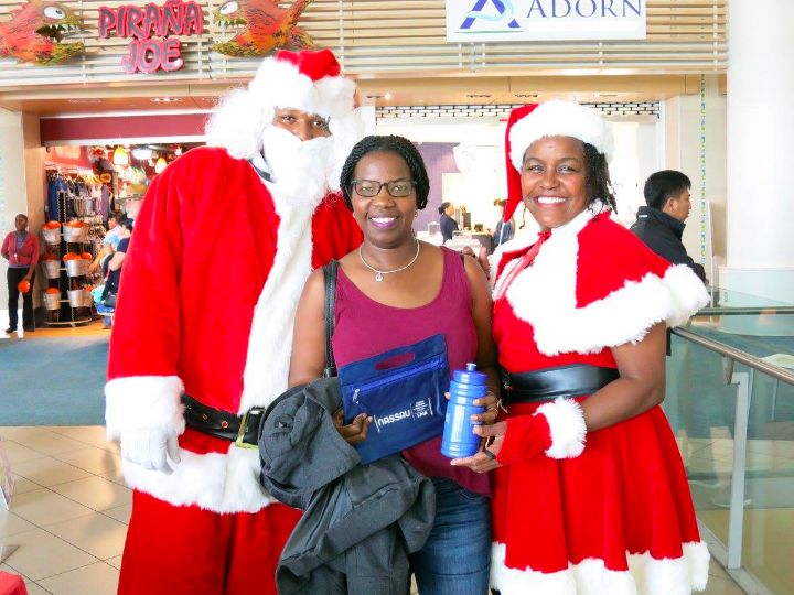 Photo_2-_Santa_and_his_helpers_bring_holiday_cheer_to_LPIA_passengers.jpg