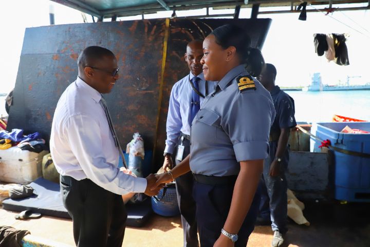 Photo_3_-_Minister_of_Agriculture_and_Marine_Resources__the_Hon._Michael_Pintard_and_Senior_Lieutenant_Samantha_Hart__Commanding_Officer_HMBS_Cascarilla_Inspecting_Dominican_Poachers_Vessel_1.jpg