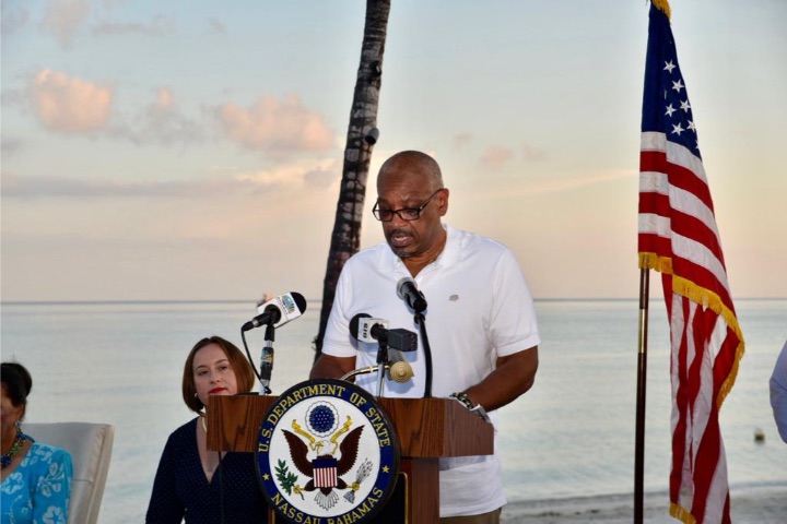 Prime_Minister_Minnis__at_Podium__and_US_Charge_d_Affaires_Stephanie_Bowers.jpg