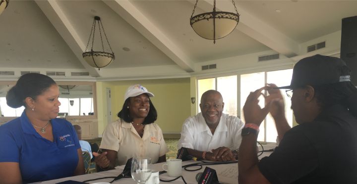 Sanique_Culmer__GB_Bahamas_Tourist_Office_and_Carmel_Churchill_of_G_B_Tourism_Board_chatting_with_Hot_105_s_James_T.__Looking_on_at_right__Don_Wiggins_of_the_Wiggins_Agency.jpg