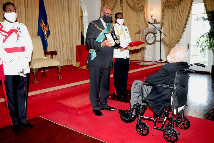 Sir_Godfrey__seated__Presented_with_Insignia_at_His_Investiture_Ceremony_at_Government_House_-_September_28__2020.jpg