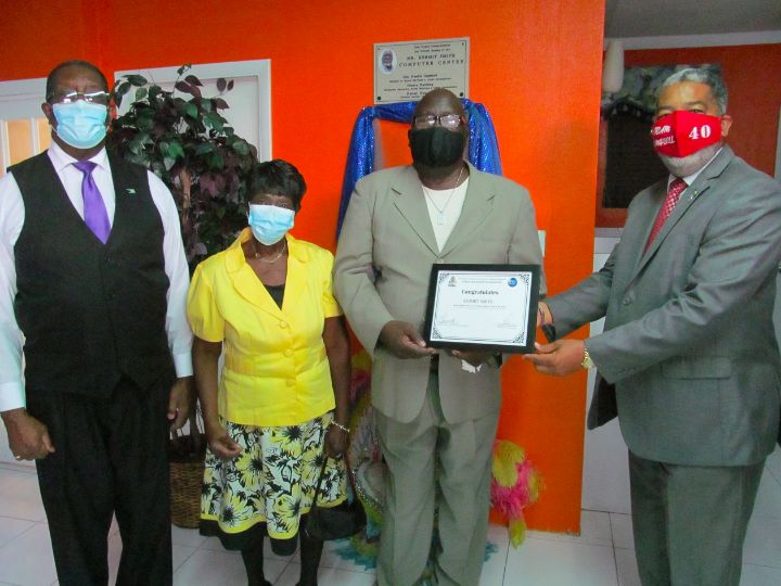 9450_-_Honouree_Kermit_Smith_Receives_Certificate_from_Minister_Campbell.jpg