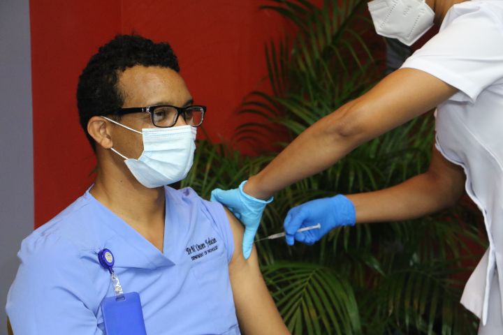 Ezra_Long_Lab_Director_Dr_Wayne_Felicien_receives_Vaccine.jpg