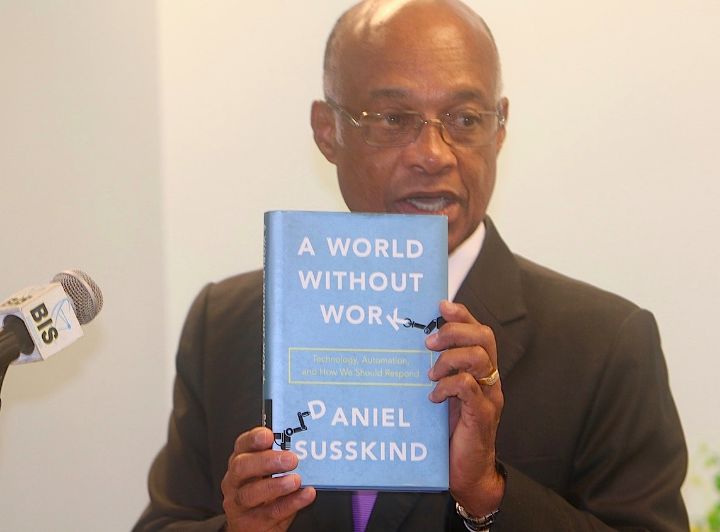 Minister_Lloyd_displays_the_book_-__A_World_Without_Work_-_Technology__Automation__and_How_We_Should_Respond_.jpg