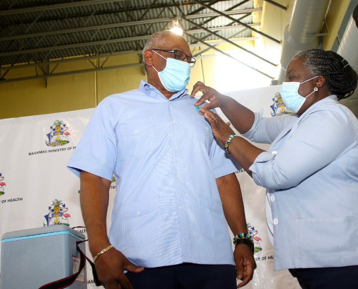 Prime_Minister_Minnis_receives_his_sticker_to_confirm_second_dose_of_Vaccne.jpg