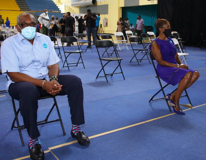 Prime_Minister_and_Mrs_Minnis_wait_in_observation_area_after_second_dose_of_vaccine.jpg