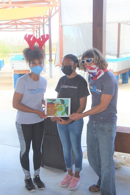 Rachelle_Manchester__EARTHCARE_Eco_____Kid_presents_Allannah_Vellacott_and_Joe_Oliver_with_a_Green_Heron_print___as___a_token_of_our_appreciation.jpg