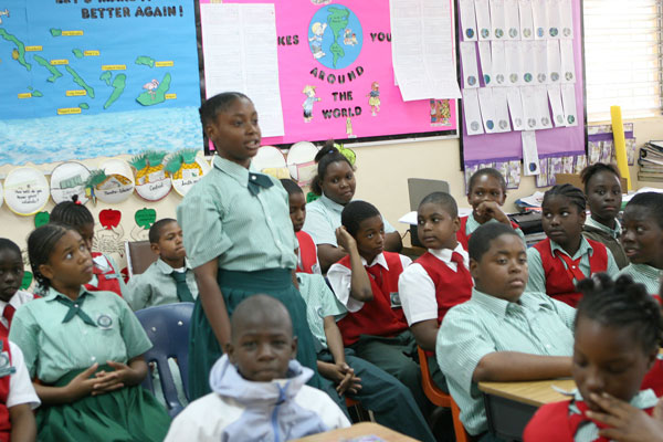 Carmichael Primary School sixth grader Alexis Woodside asks a question of 