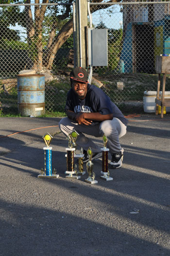 Ken-Wood-Jr._-displaying_his_various_awards.jpg